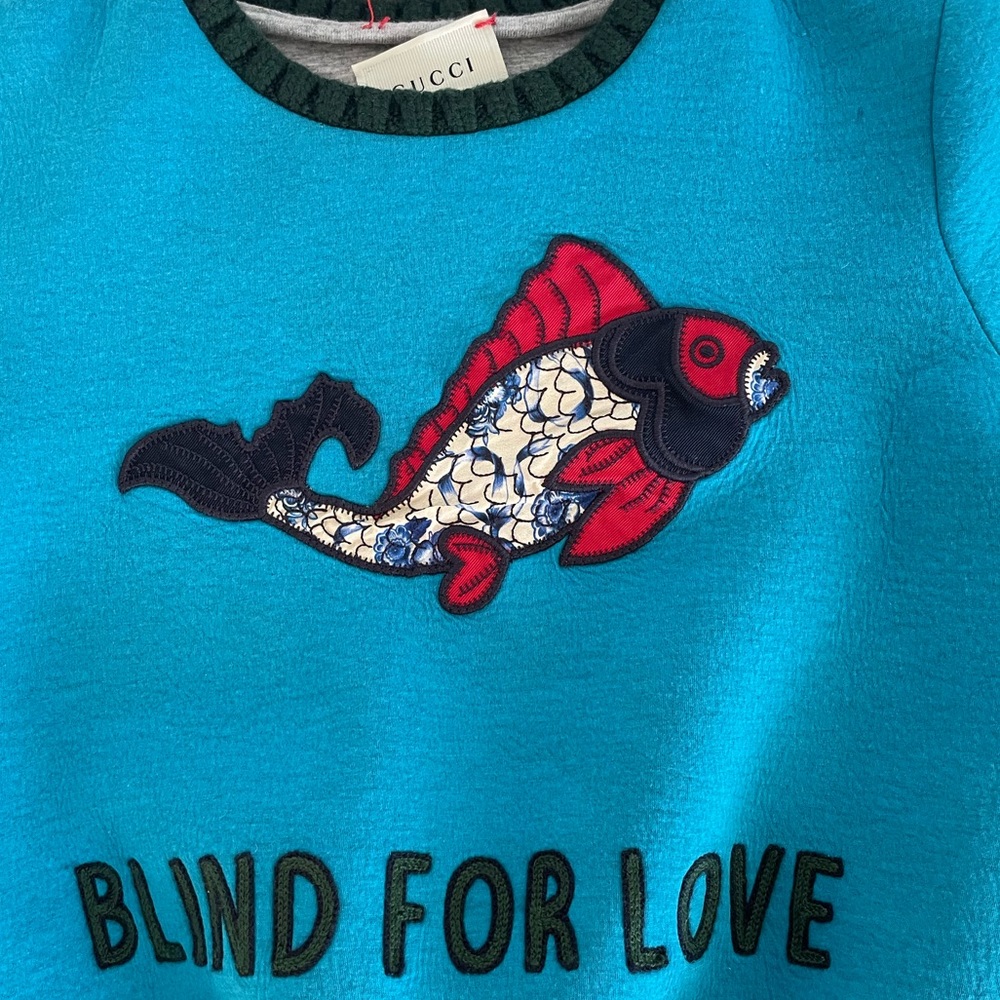 Toddler boys Gucci sweater. Tag is coming off. Small stains on back.